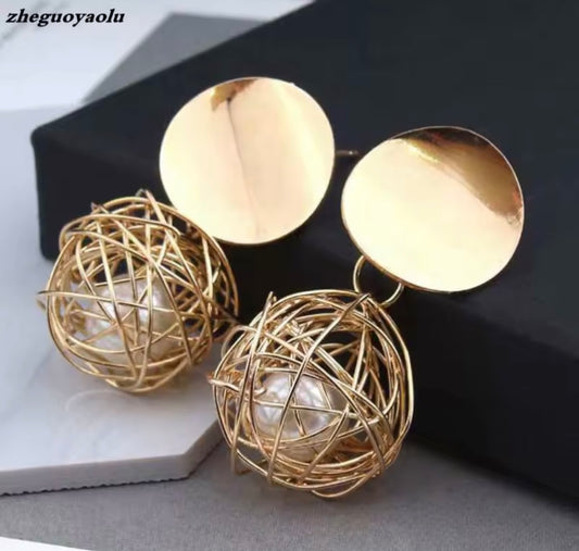 Pearl In A Nest Earring.