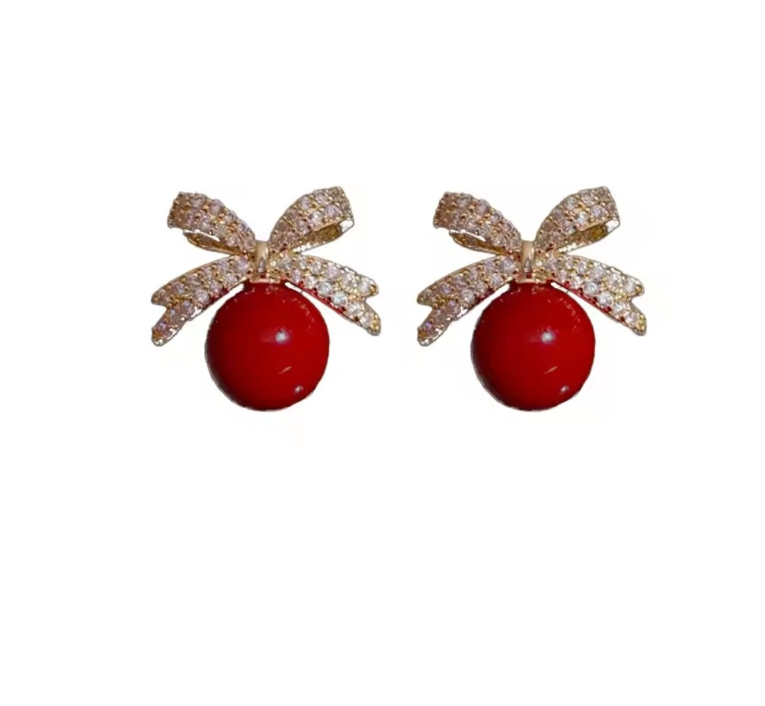 Bow And A Ball Earring.