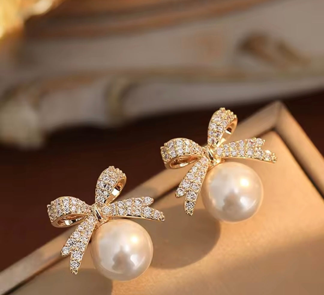 Bow And A Ball Earring.