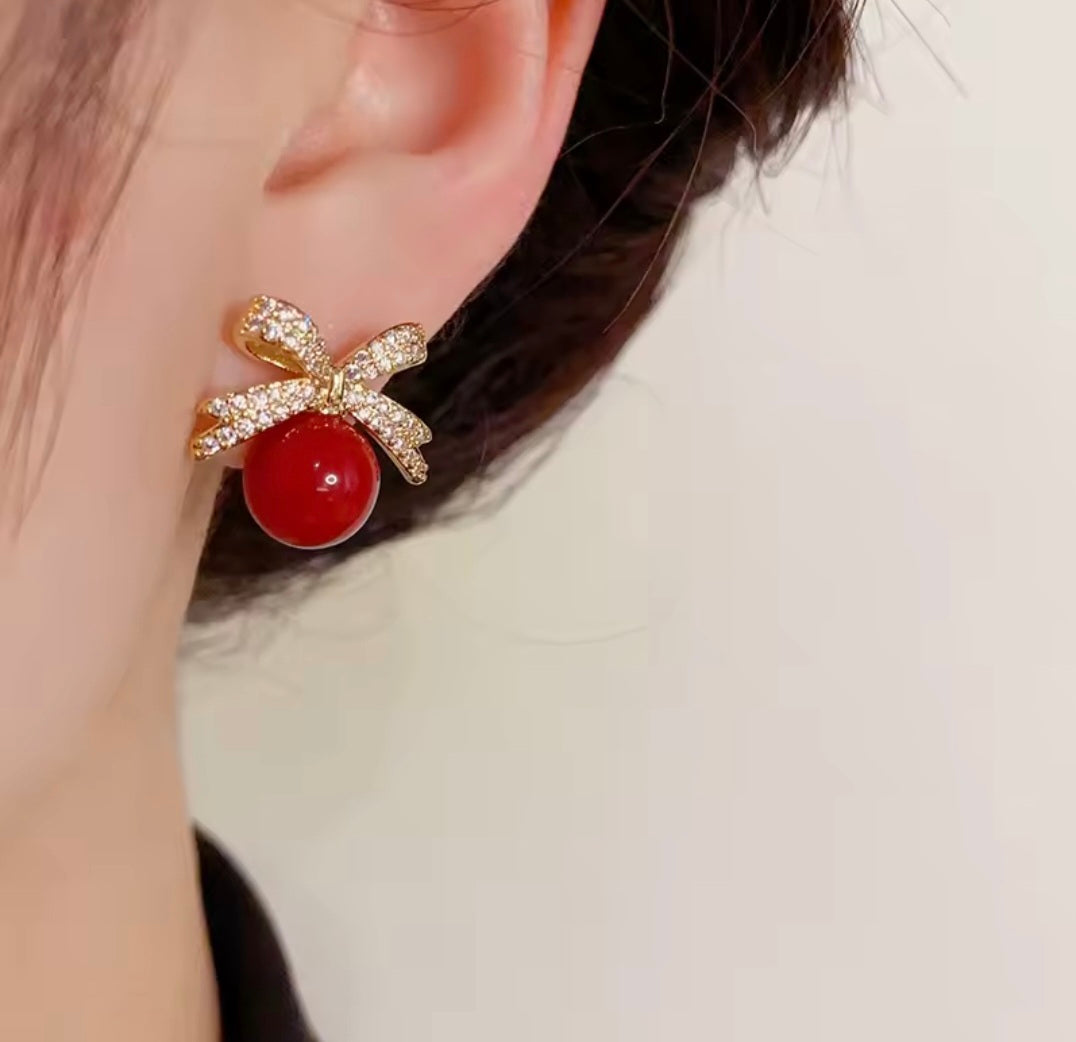 Bow And A Ball Earring.